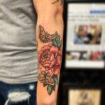 Mike Duncan custom rose forearm tattoo